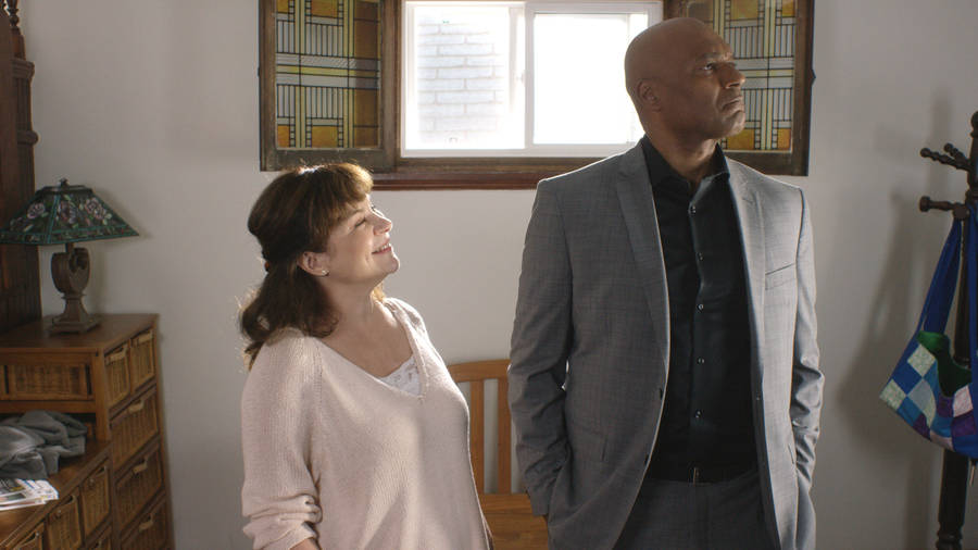 Colin Salmon Next To Woman Wallpaper