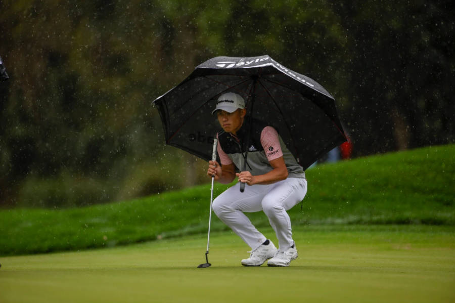 Collin Morikawa Under An Umbrella Wallpaper