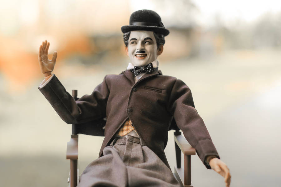 Colored Charlie Chaplin Figurine Wallpaper