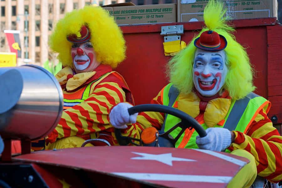 Colorful Clowns Driving Car Wallpaper