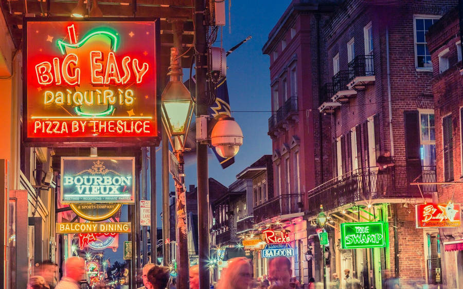 Colorful Vibrancy Of French Quarter At Night Wallpaper