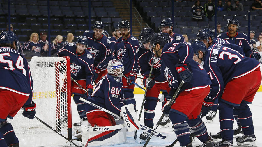 Columbus Blue Jackets Team Playing Hockey Wallpaper