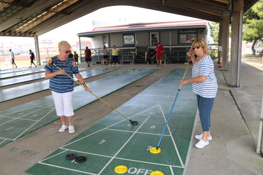 Competitive Shuffleboard Tournament In Ocean City Wallpaper