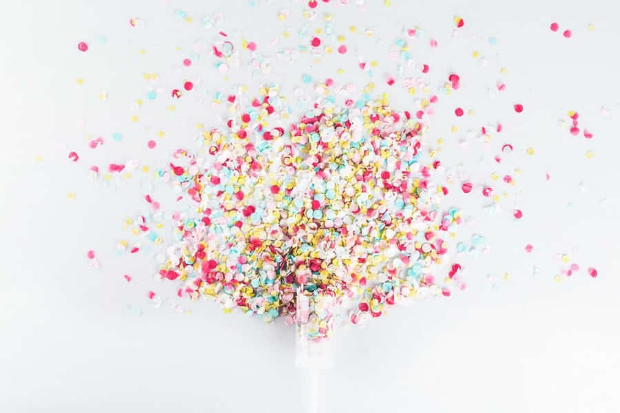 Confetti Falling From A Bottle Wallpaper