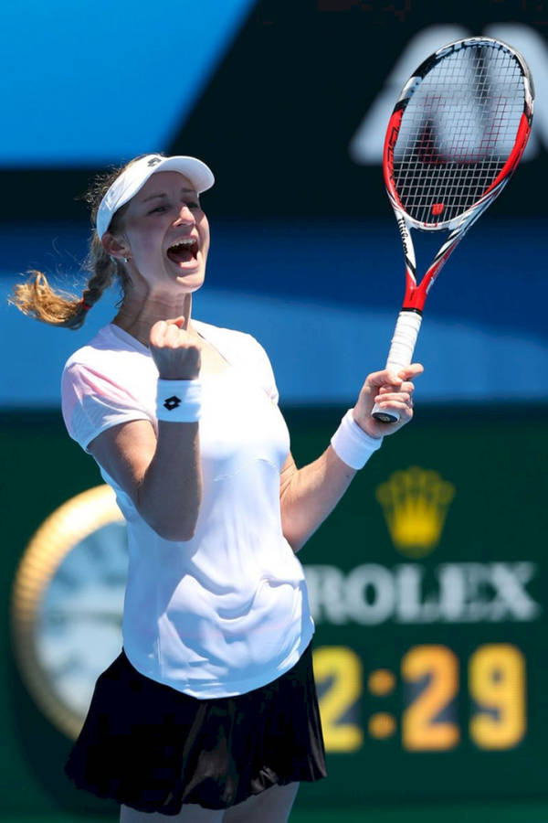 Confident Ekaterina Makarova Celebrating With A Fist Pump During Match Wallpaper