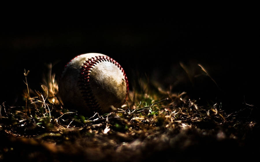 Cool Baseball Ball On The Ground Wallpaper