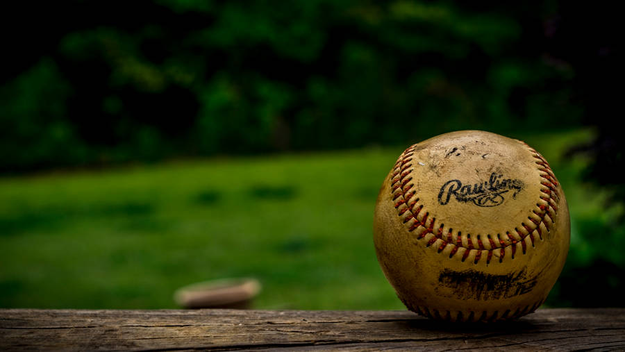 Cool Baseball Ball On Wood Surface Wallpaper