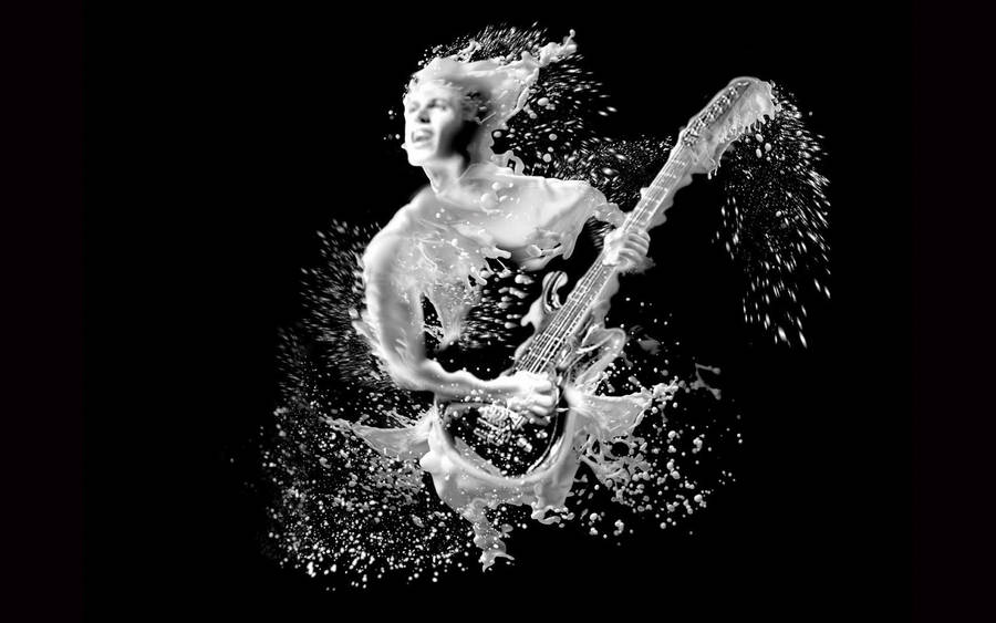 Cool Guitarist On Black Wallpaper