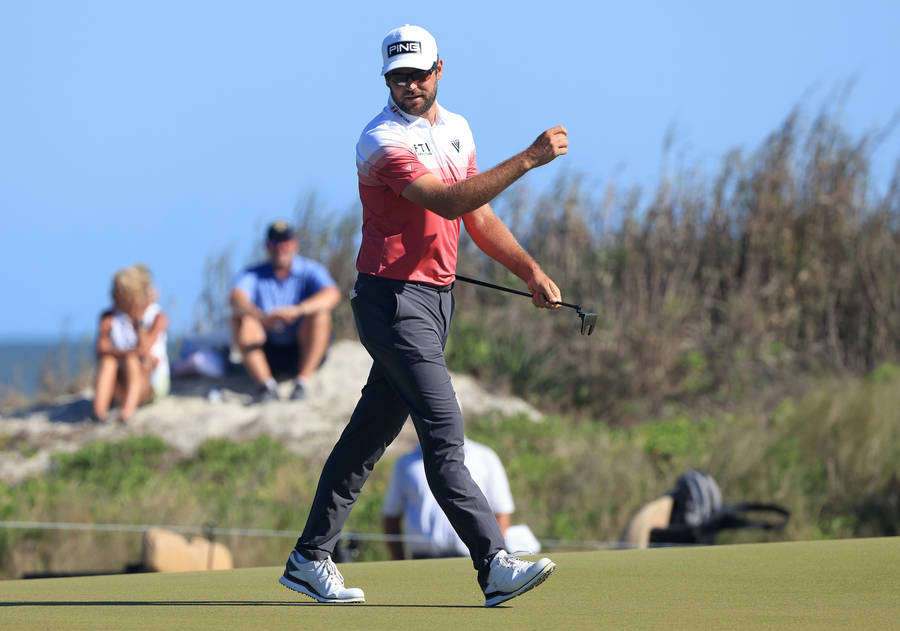 Corey Conners Striding On The Golf Course Wallpaper