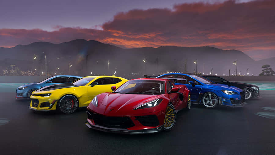 Corvette_ C8_ Amidst_ Sports_ Cars_at_ Dusk Wallpaper