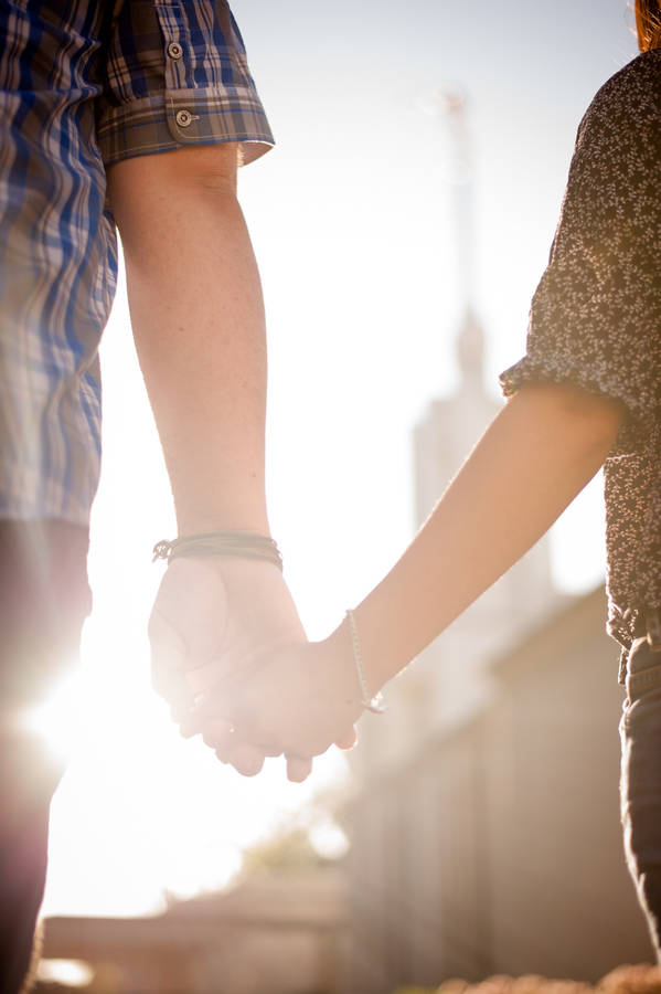 Couple Holding Hands At Temple Wallpaper