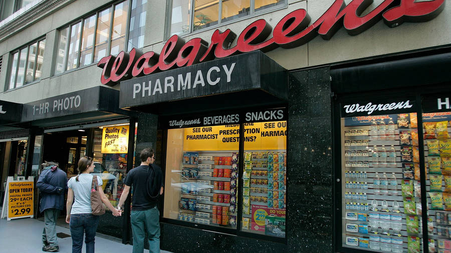 Couple Near Walgreens Pharmacy Wallpaper