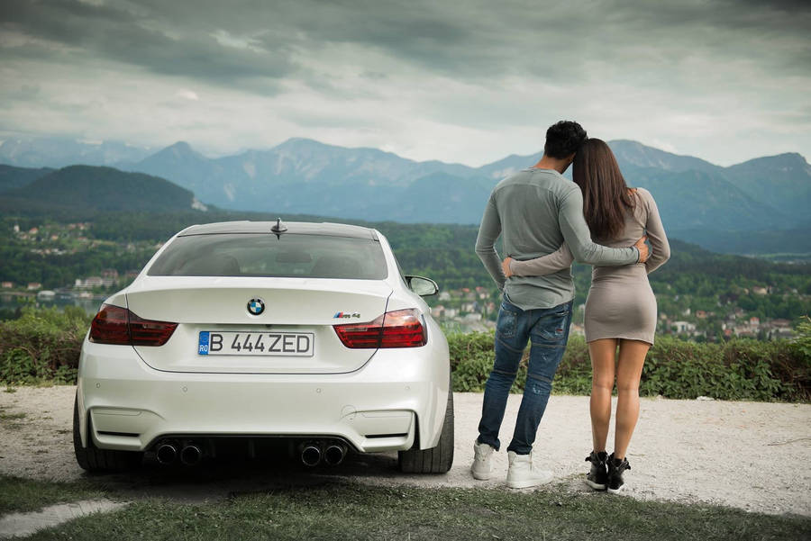 Couple With White Bmw M4 Wallpaper