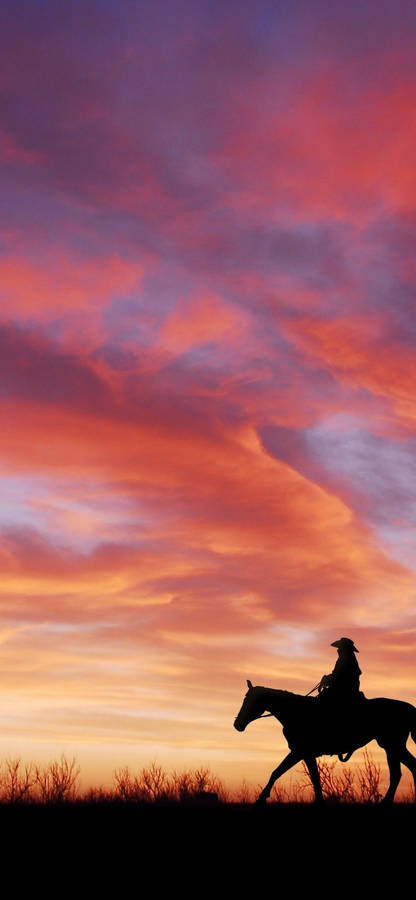 Cowboy Silhouette On Dusk Wallpaper