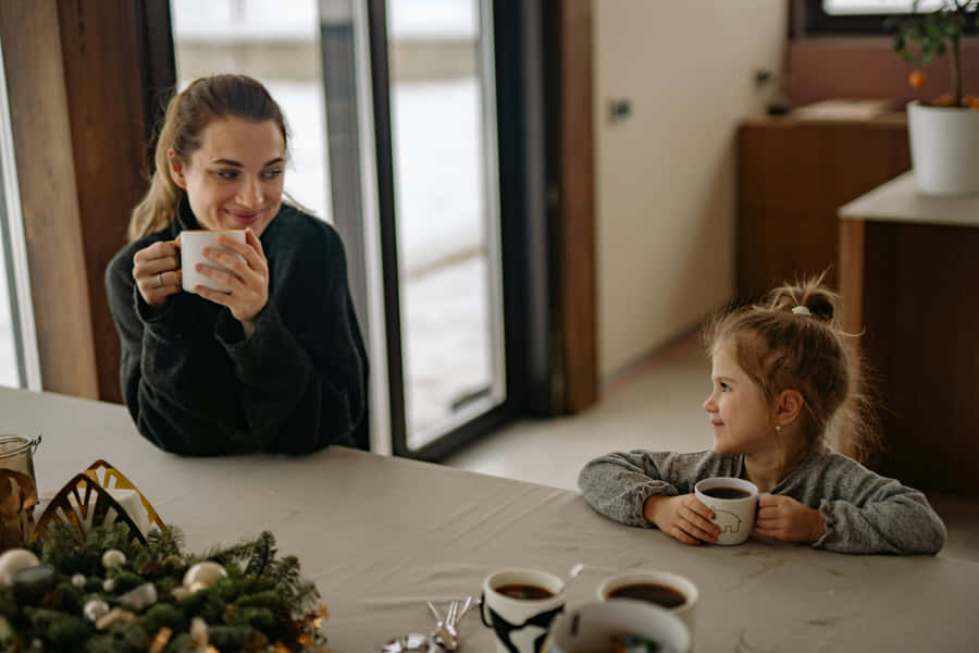 Cozy Morning Coffee With Child Wallpaper