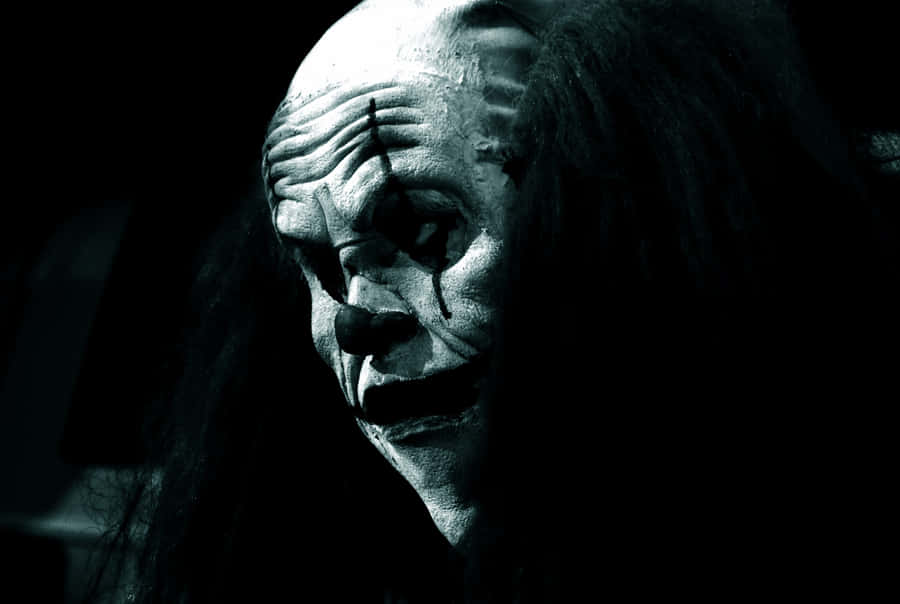 Creepy_ Clown_in_ Shadows.jpg Wallpaper