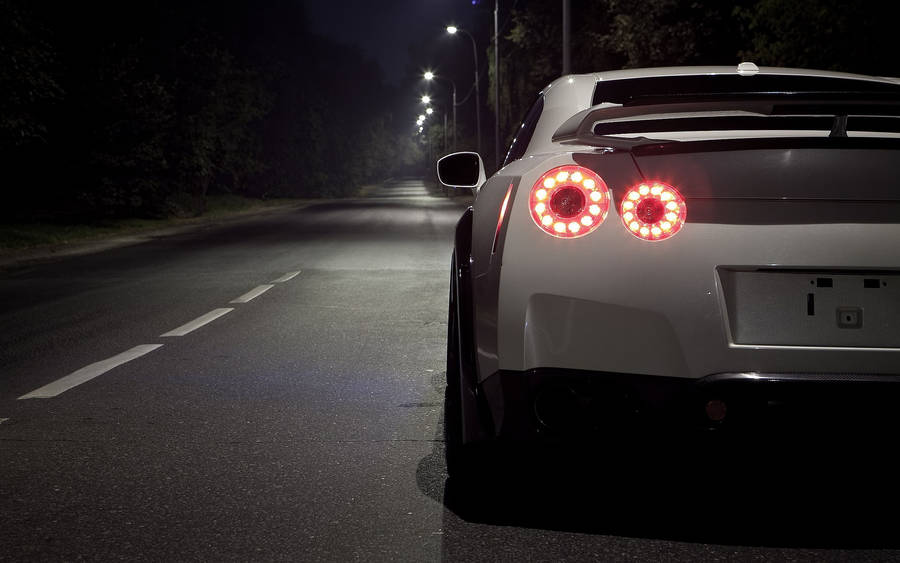 Cropped Photo Of A White Nissan Gtr Car Wallpaper