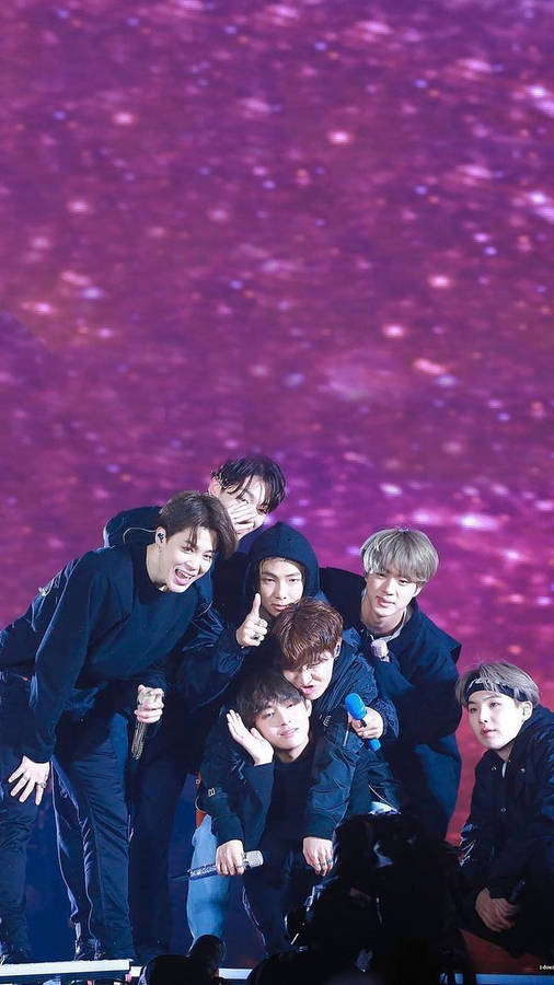 Cute Bts Group In A Hazy Glittery Purple Backdrop Wallpaper