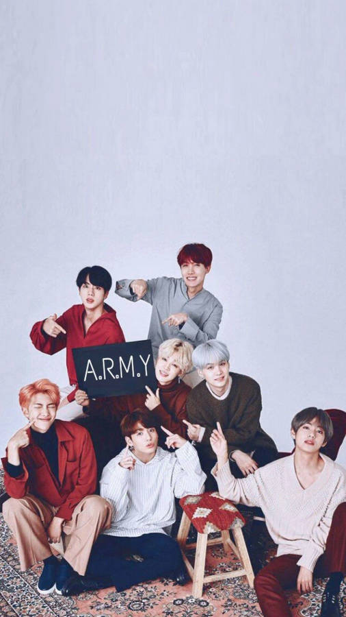 Cute Bts Group Posing On Pastel Purple Backdrop Wallpaper