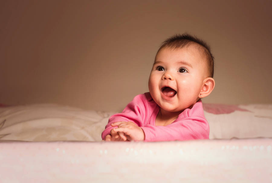 Cute Fun Baby In Pink Wallpaper