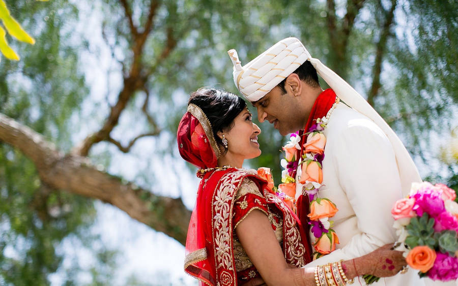 Cute Indian Couple In Wedding Attire Wallpaper