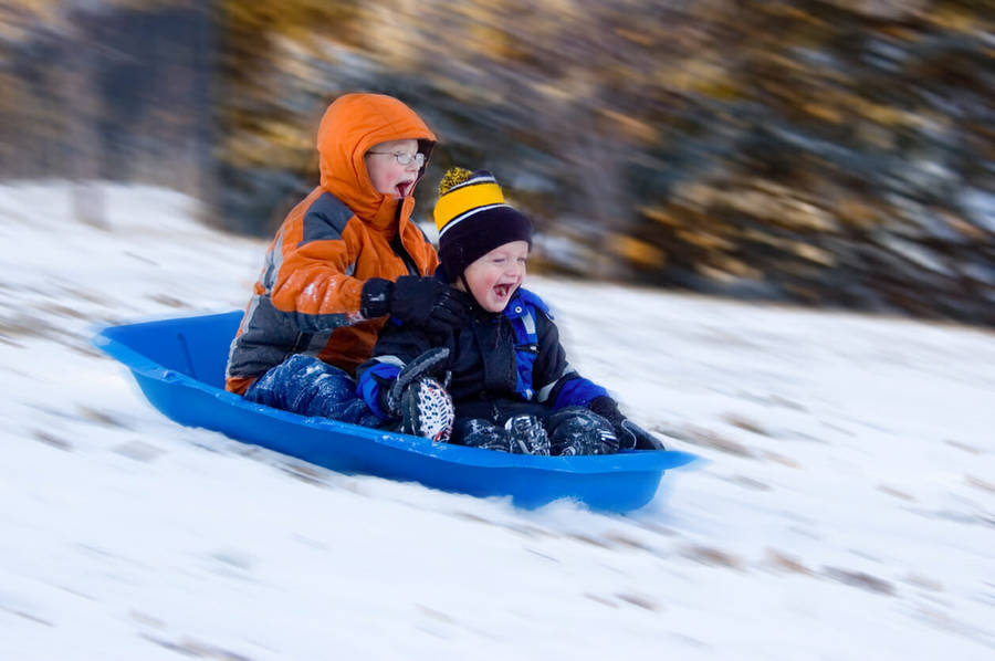 Cute Kids Happy Sledding Wallpaper