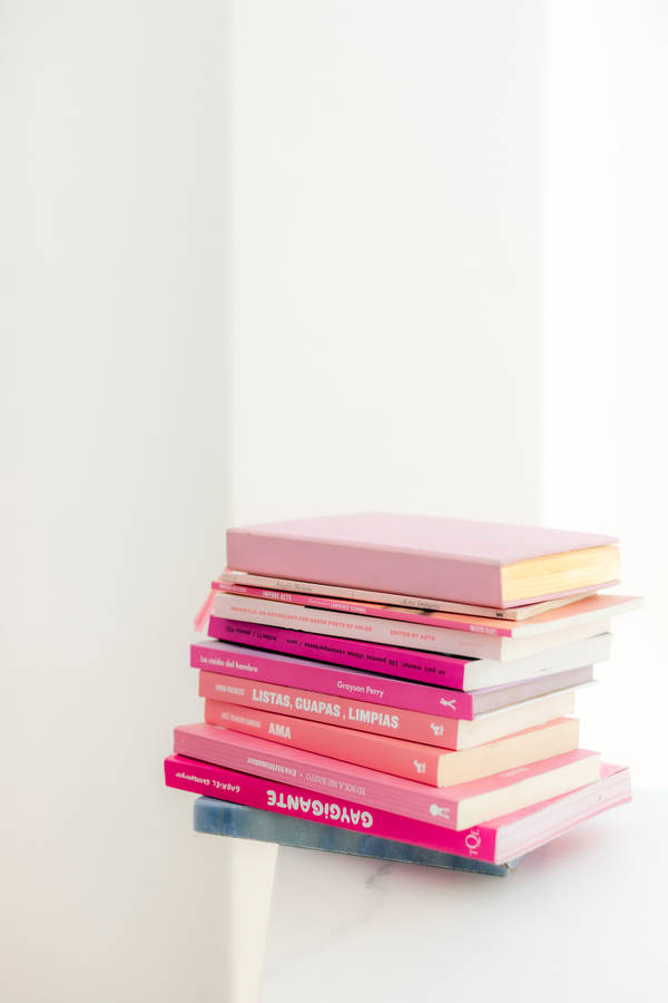 Cute Pink Aesthetic Pile Of Books Wallpaper