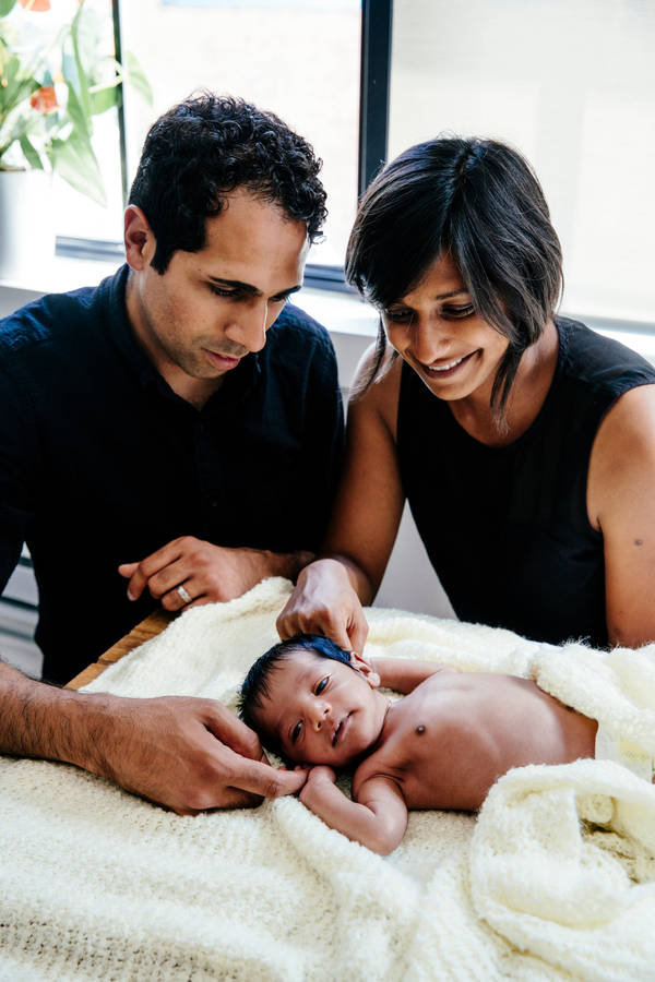 Dad And Wife With Newborn Wallpaper