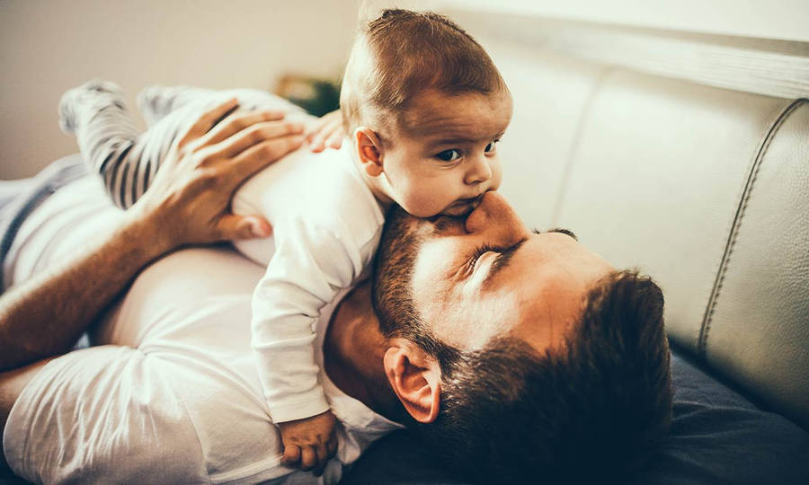 Dad Laying With Son Wallpaper