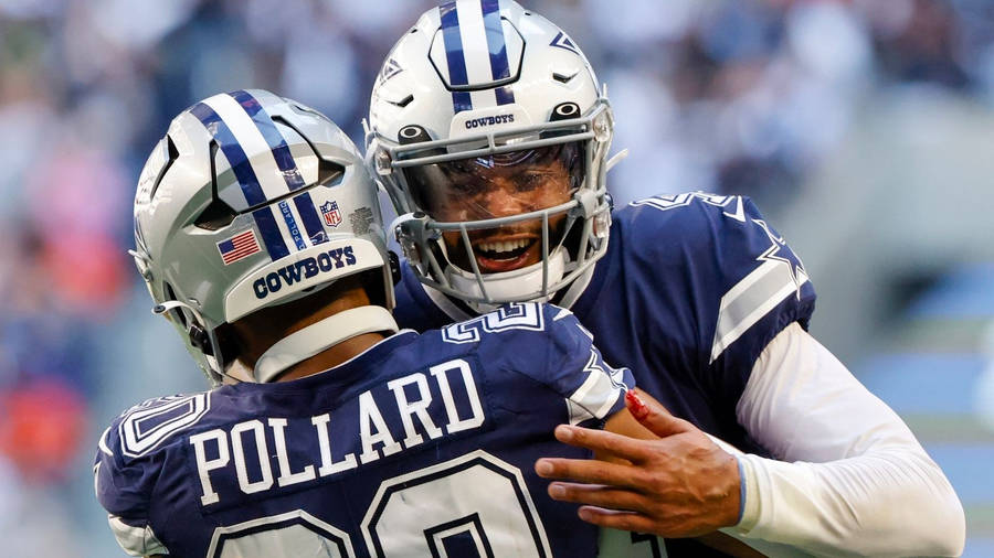 Dallas Cowboys Hugging And Smiling Wallpaper