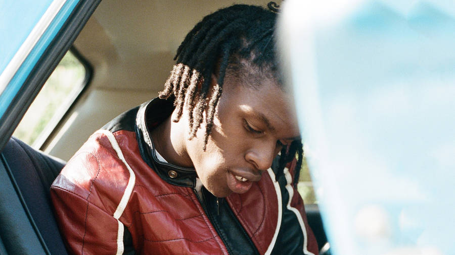 Daniel Caesar In Car Wallpaper