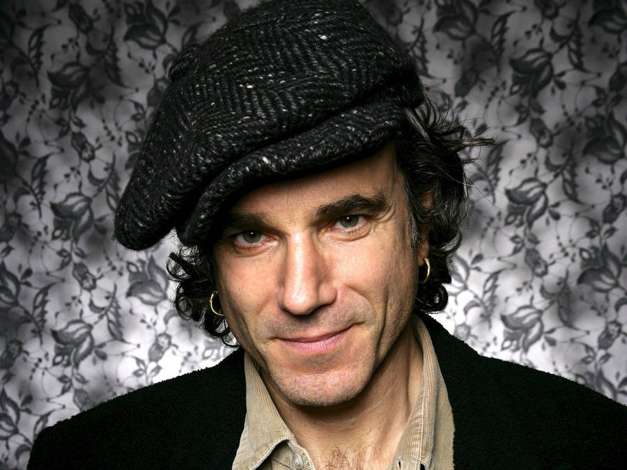 Daniel Day-lewis Captivating Stance Against A Vibrant Floral Background Wallpaper