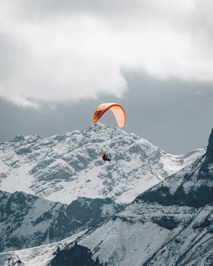 Daredevil Paraglider Soaring Through The Sky Wallpaper