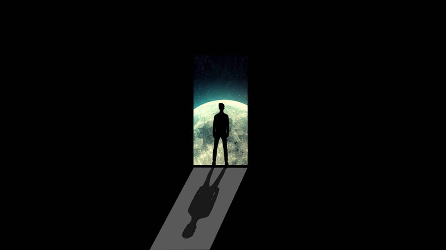 Dark Laptop Man Standing Facing The Planet Wallpaper