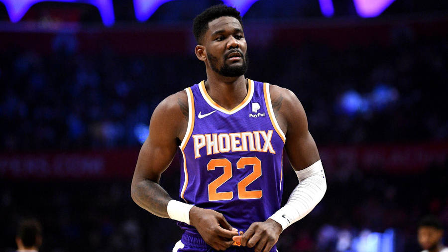 Deandre Ayton Confidently In Action On The Basketball Court Wallpaper