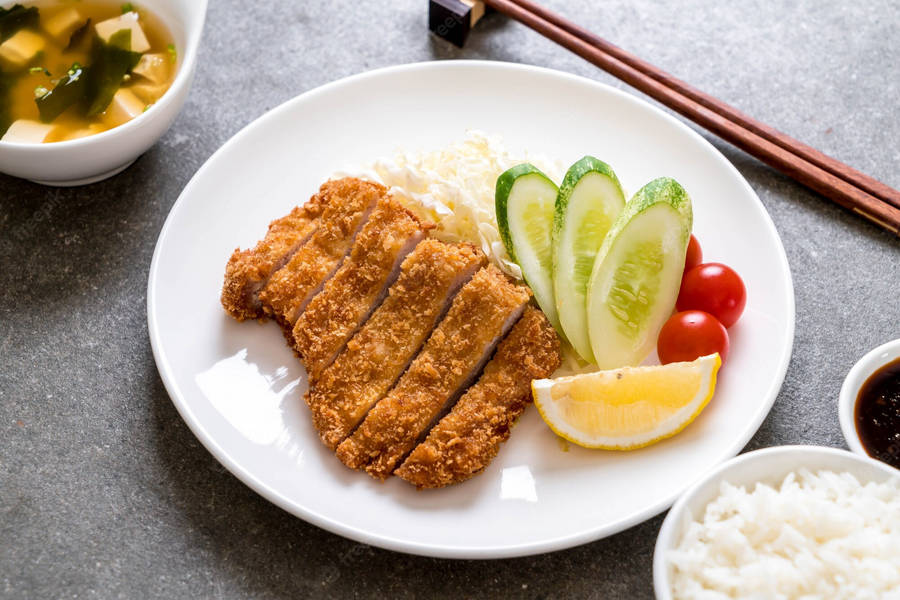 Deep-fried Tonkatsu On A White Plate Wallpaper