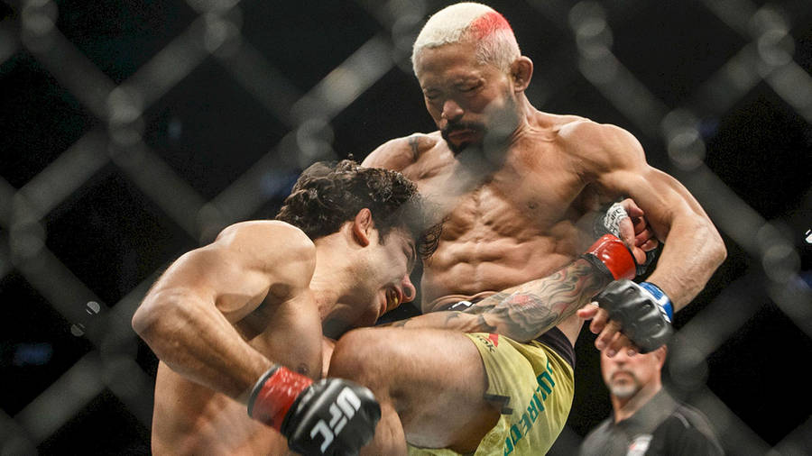 Deiveson Figueiredo In Intense Fight Wallpaper