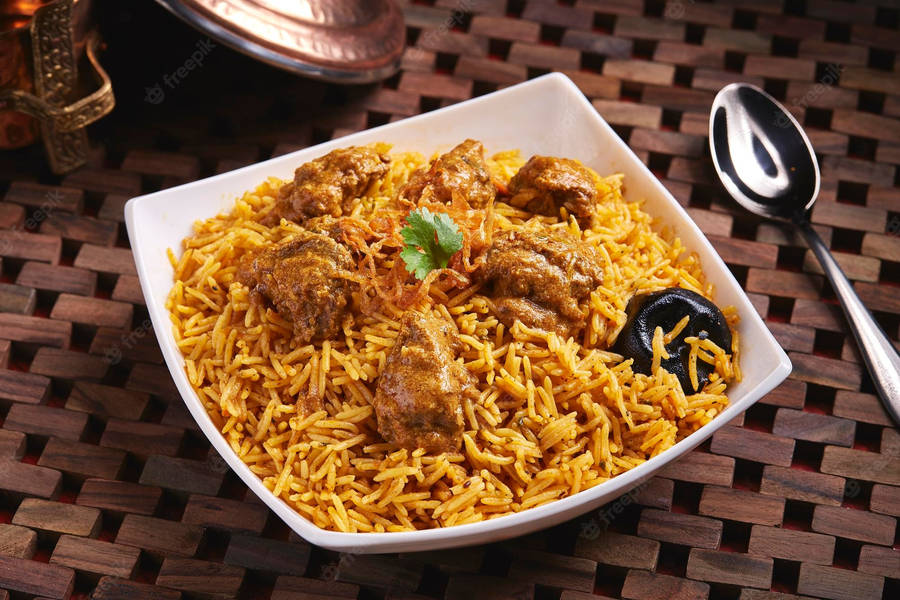 Delectable Biryani In A Stylish White Dish Wallpaper