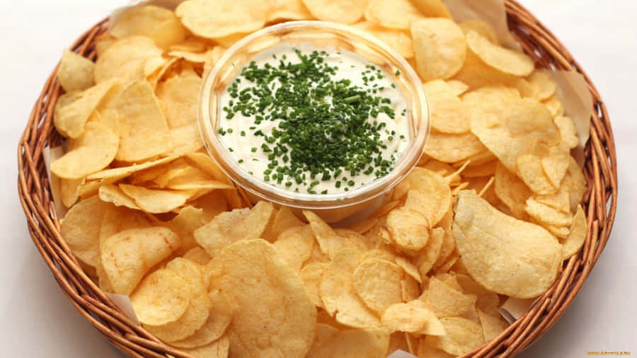 Delectable Chips And Dip In A Woven Basket Wallpaper