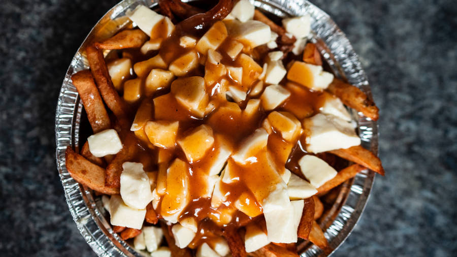 Delectable Poutine Plate - Canadian Signature Snack Wallpaper