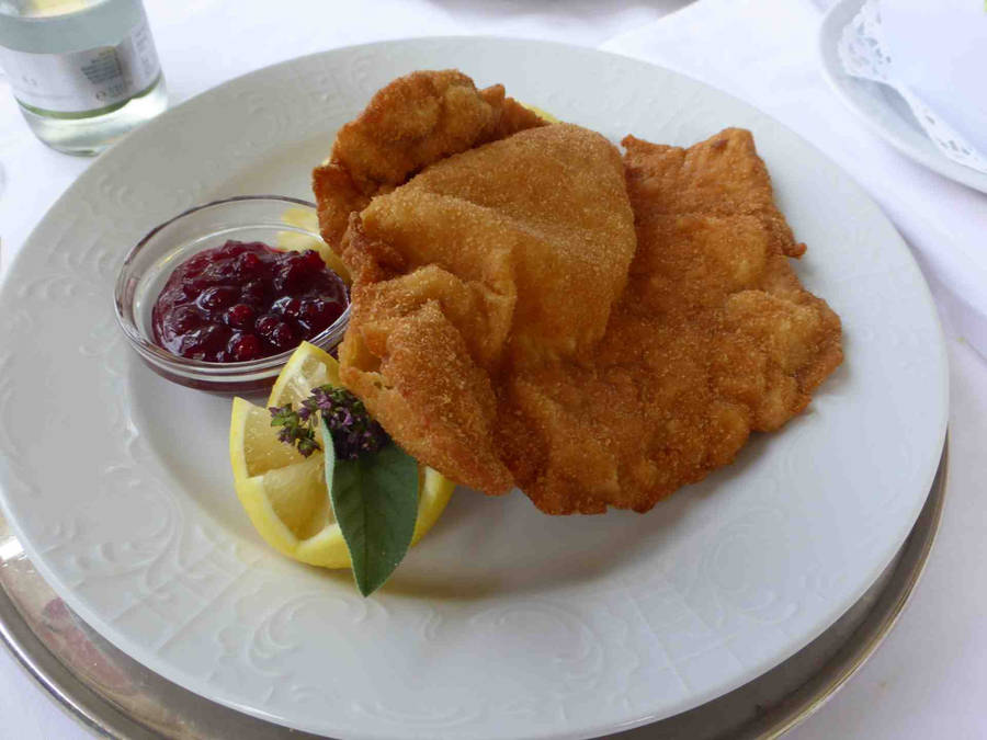 Delectable Wiener Schnitzel With Tangy Cranberry Sauce Wallpaper