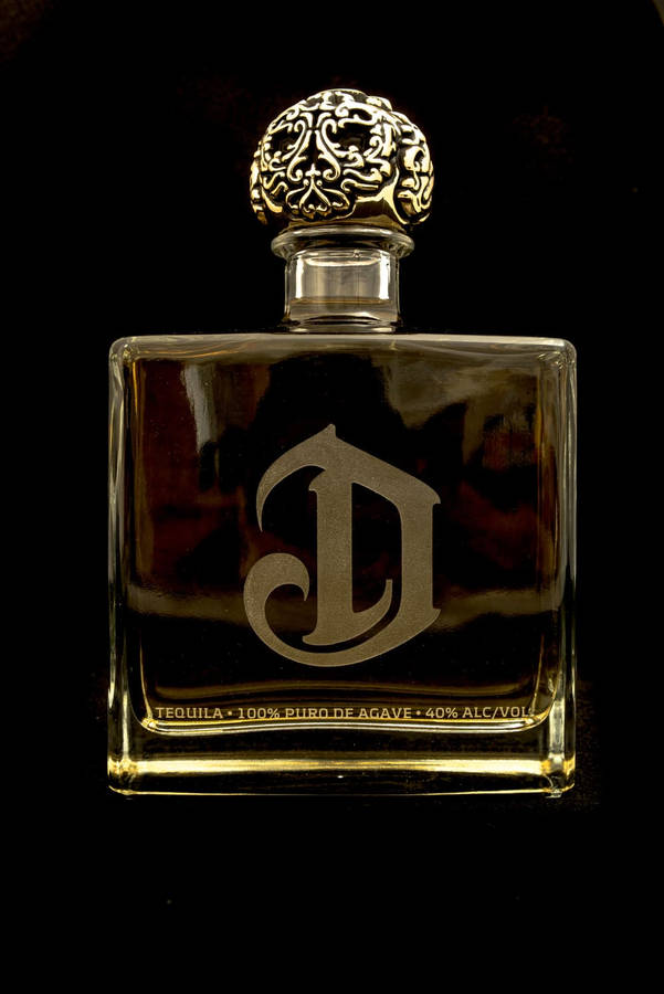 Deleón Tequila Dark Golden Bottle Wallpaper