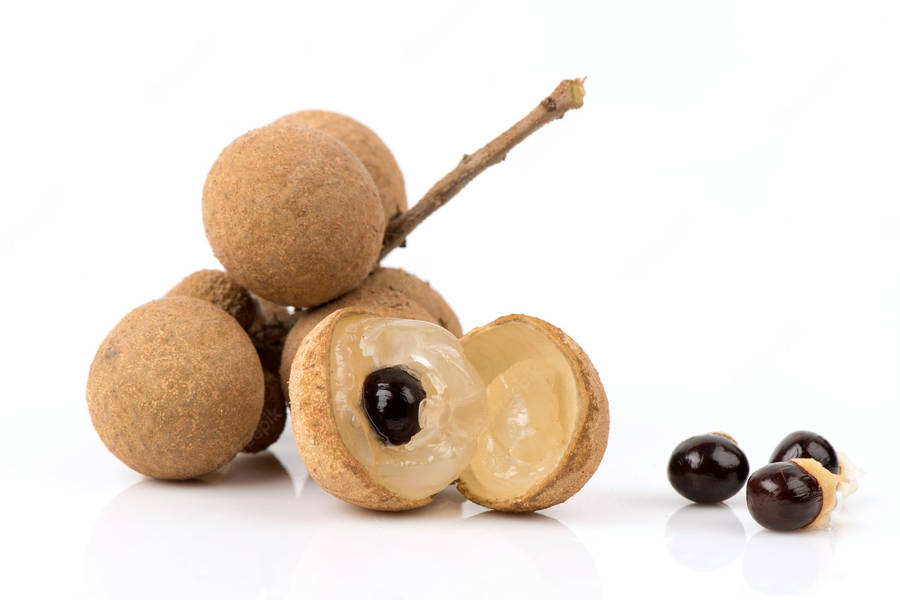 Delicious Longan Fruits And Seeds On Display Wallpaper