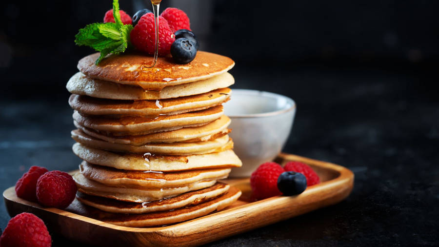 Delicious Pancakes Served On Tray Wallpaper