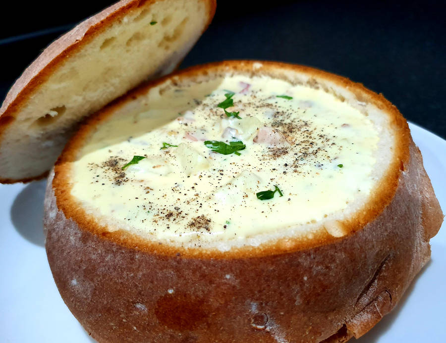 Delicious Sourdough Bread Bowl Filled With Creamy Chowder Wallpaper