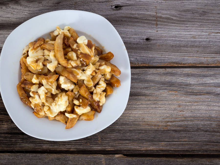 Delightful Plate Of Authentic Poutine Wallpaper