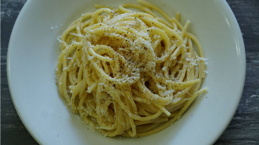 Delighting In A Plate Full Of Exquisite Cacio E Pepe Wallpaper