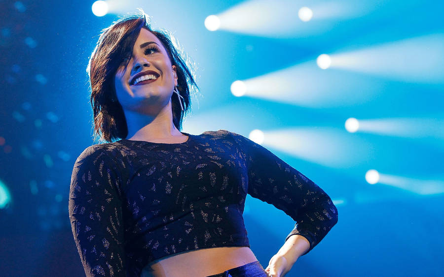 Demi Lovato Against Spotlights Wallpaper