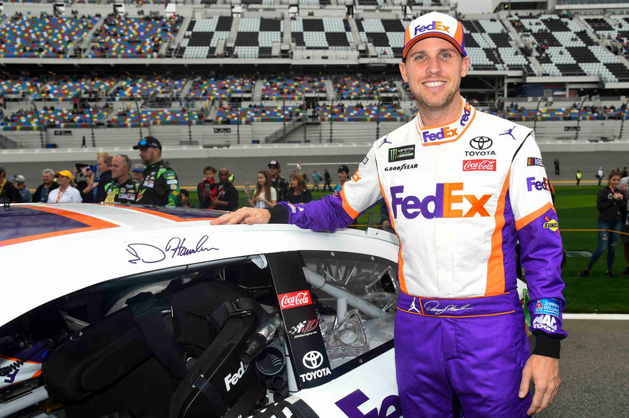 Denny Hamlin Signing His Car Wallpaper