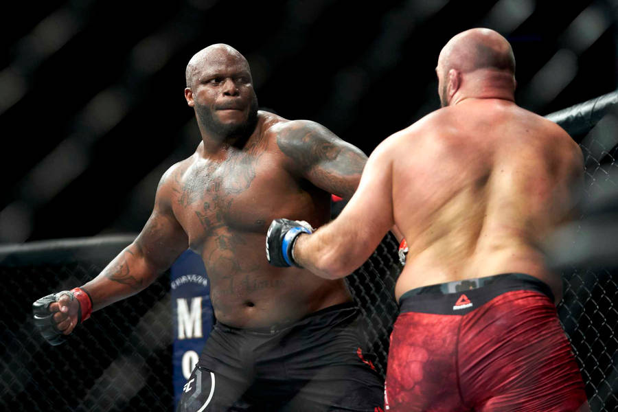 Derrick Lewis Unleashing A Powerful Punch Wallpaper